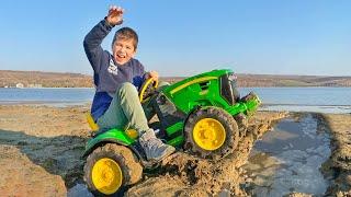 Excavator digging dirt near the lake and Darius wants to save people from water  Kidscoco Club