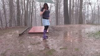 Cross Dresser Purple Platform Boots in the rain and mud