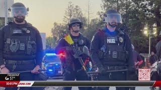 Protesters clash with police outside Tesla factory in Fremont