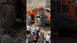 Develon DA30 dump truck  showing its mastery of rough and uneven ground to the crowds.