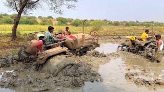 Solis tractor stuck in mud pulling out by John Deere tractor  tractor 