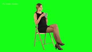 Girl sitting on chair and driking coffee Green Screen Footage