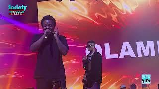 WIZKID SPRAYS ZAZOO ZEH CROONER WHILE PERFORMING ON STAGE WITH OLAMIDE AT HIS LIVE CONCERT IN LAGOS