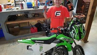 Servicing his brand new Dirt bike a KX65 2 stroke. Fun