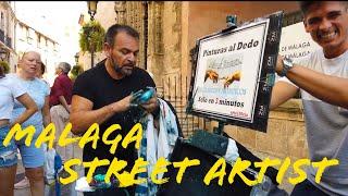 Málaga Pinturas al dedo street artist finger painting Malaga city centre