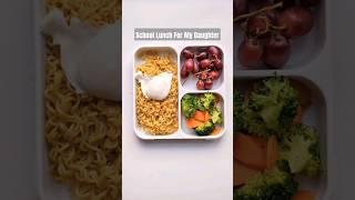 What I pack for my daughters school lunch Mi goreng noodles poached egg vegetables and grapes