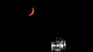 7-3-2022 moon setting by the Lorain Lighthouse