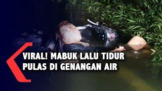 Viral Pria Mabuk Tidur Pulas di Genangan Air