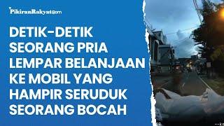 Detik-detik Seorang Pria Lempar Belanjaan ke Mobil yang Hampir Seruduk Seorang Bocah