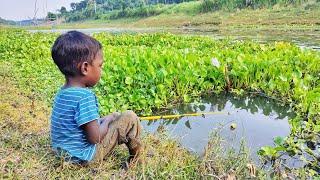 Hook fishing video - traditional little boy catching fish with a fish hook from village river