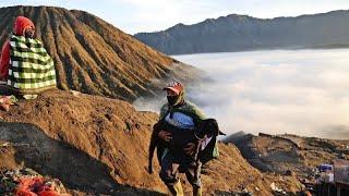 Hindus in Indonesia throw ritual offerings to gods into active volcano