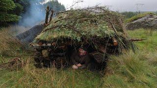 bushcraft shelter and cooking with hot stones rainy day in ireland