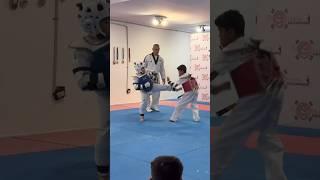 Taekwondo Sparring jian 8 yo blue against 11 yo red