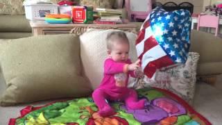 Everly playing with a balloon