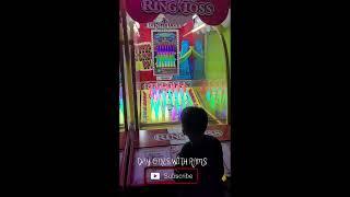 RING TOSS ARCADE GAME AT CANADIAN MIDWAY ARCADE CLIFTON HILL NIAGARA FALLS NOV 2023