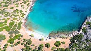 4K Drone Footage of Kolokitha Beach crystal turquoise water pure golden fine sand in Crete Greece