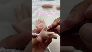 Sculpting baby hands in polymer clay tutorial.