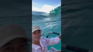 Huge surge wave nearly takes boats and people with it