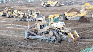 CAT D10N Dozers and 651E scrapers at work - Massive earth moving -