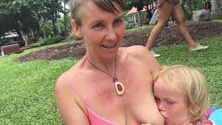 Public Breast feeding four year old gets both breasts out