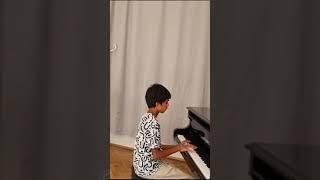 Practicing Queen of Kings Alessandra Mele on Piano