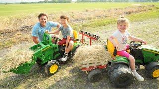 Using kids tractors to clean hay from barn and fields  Tractors for kids