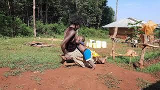 Funny Breastfeeding Toddler African village life