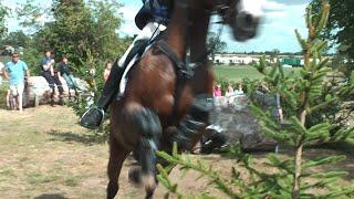 Horse and Rider jump at Cameraman
