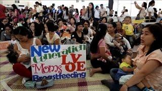 Filipino mothers breastfeed babies to raise awareness