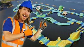 Handyman Hal explores floating Water Park  Obstacle Island Big Jumps  Fun Videos for Kids