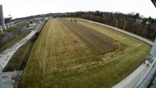 Fraze mowing Iowa State Universitys Johnny Majors practice football field