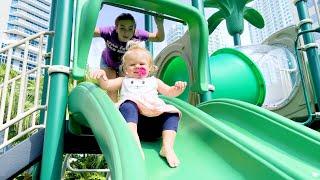 Maggie Plays on the playground with baby brother