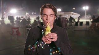 Dylan Sprayberry blowing bubbles