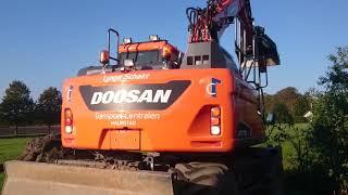 DOOSAN DX 170 W Cleaning Out a Pond Containing Koi