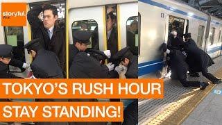 Passenger Squeezes Onto Tokyo Subway During Rush Hour
