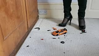 Crushing my sons Orange Toy Car in Black High Heels 