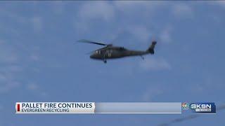 Army National Guard helicopter dumps water on Evergreen Recycle fire