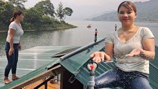 The girl channels water to create rain to cool the house on the lake.