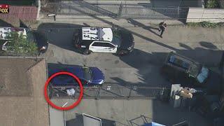 Come on guys Hes right there Pursuit suspect tries to evade LAPD by laying next to vehicle