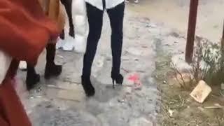 Chinese Girl KEEPS TRIPPING in high heels on cobblestones