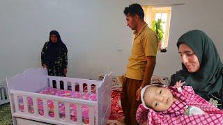 Hasan village family in the city.  Construction workers continue to install mosaics in the courtyard