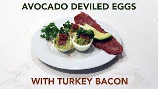 Avocado deviled eggs with turkey bacon