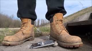 Well worn dirty Timberland Boots stomp trample and destroy iPhone 6s