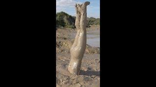 Girl playing in mud  jumping in mud