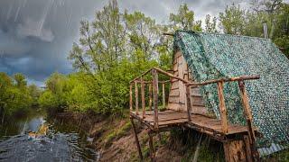 THE RAIN CAUGHT ME IN A HUT BY THE RIVER  FISHING FROM THE BALCONY AND LANDSCAPING THE ROOF