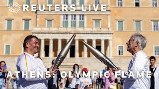 LIVE Olympic flame handed over at Athens’s Panathenaic Stadium