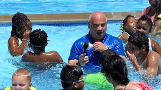 Fully clothed mayor gets pushed into pool by city kids