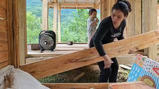 A single mother and her daughter built a wooden house wall
