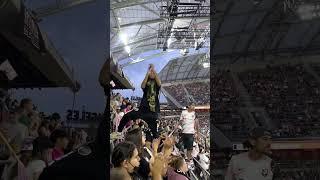 Fans Celebrating at an Angel City Football Club Game