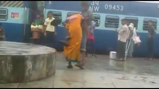 Lady fighting in railway station.